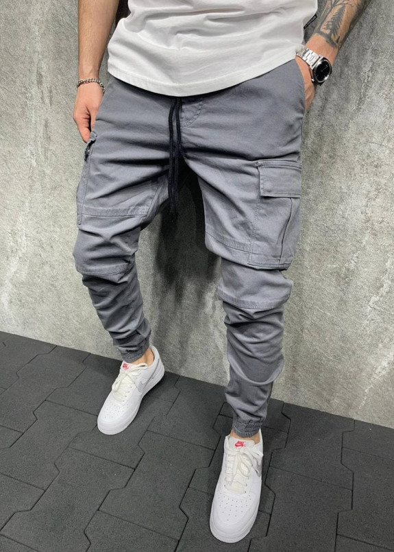 Брюки спортивные серые с карманами над просроченными вставками MFStore Изображение Брюки спортивные серые с карманами над просроченными вставками MFStore