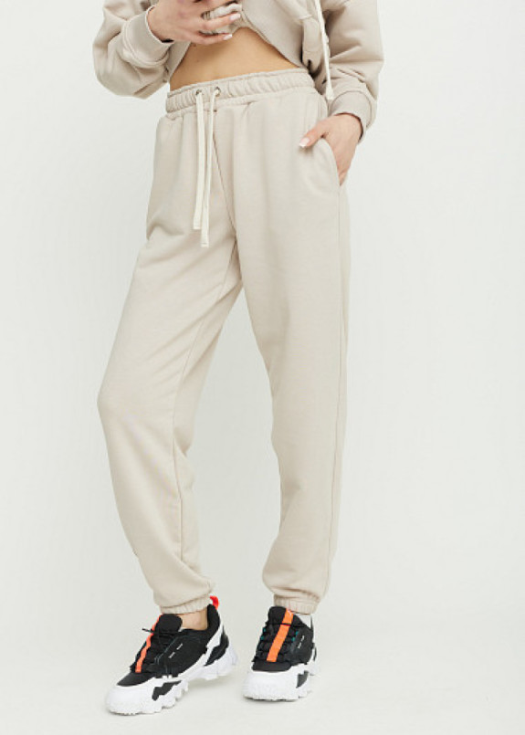 Бежеві спортивні штани вільного крою Изображение Бежеві спортивні штани вільного крою