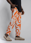 Штани вільного крою з помаранчевим малюнком MFStore Изображение Штани вільного крою з помаранчевим малюнком MFStore