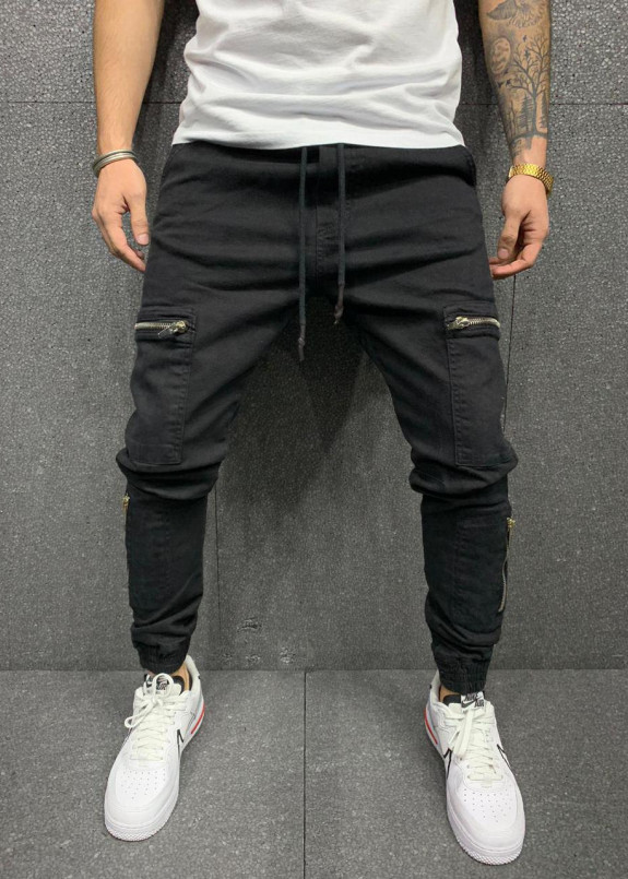 Штаны с накладными карманами и завязками на поясе и манжетах Изображение Штаны с накладными карманами и завязками на поясе и манжетах