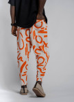 Штани вільного крою з помаранчевим малюнком MFStore Изображение Штани вільного крою з помаранчевим малюнком MFStore